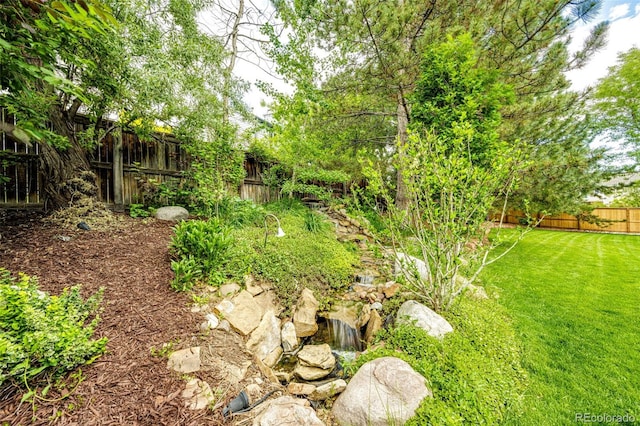 view of yard with a fenced backyard