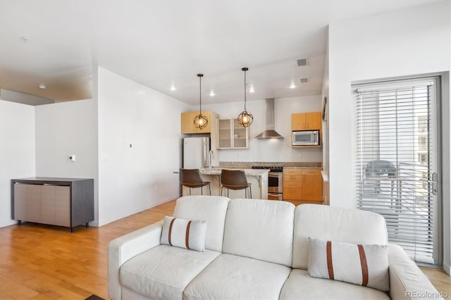 2958 Syracuse St Unit 316, Denver, CO 80238 - living room with light wood-style floors, baseboards, and recessed lighting
