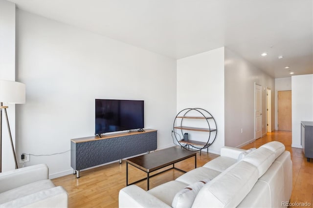 2958 Syracuse St Unit 316, Denver, CO 80238 - living room with light wood finished floors, recessed lighting, and baseboards