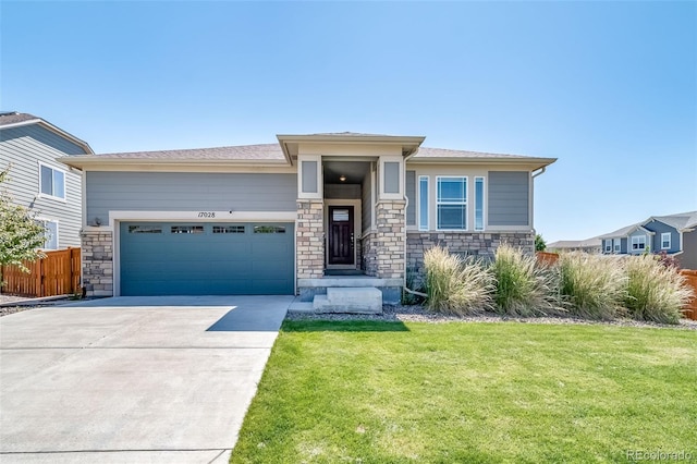 17028 Osage St, Broomfield, CO 80023 - prairie-style house featuring stone siding, driveway, and a garage