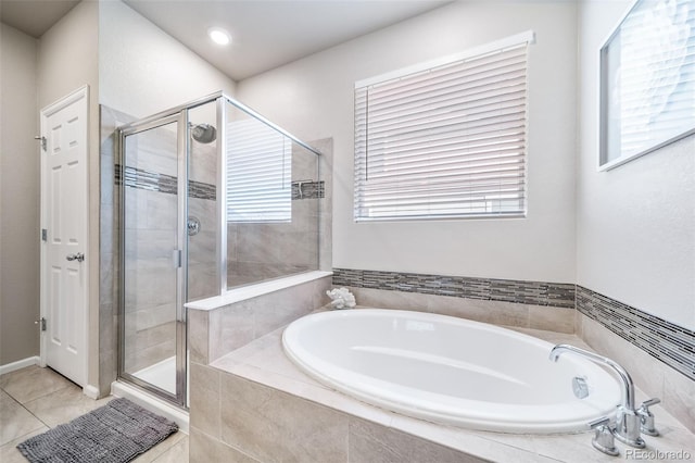 17028 Osage St, Broomfield, CO 80023 - full bath with a bath, a shower stall, and tile patterned floors