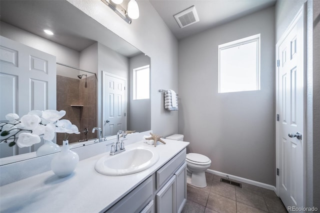 17028 Osage St, Broomfield, CO 80023 - full bath featuring vanity, tiled shower, and tile patterned flooring
