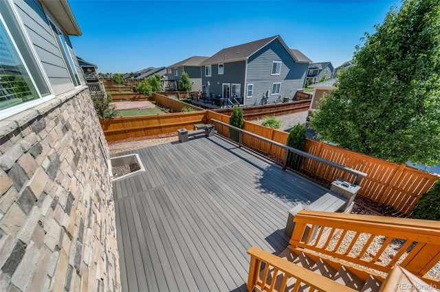 17028 Osage St, Broomfield, CO 80023 - wooden terrace featuring a residential view and a fenced backyard