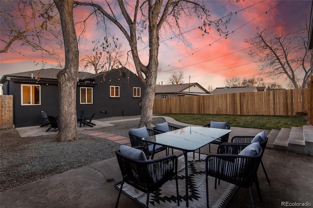 view of patio with outdoor dining space and fence private yard