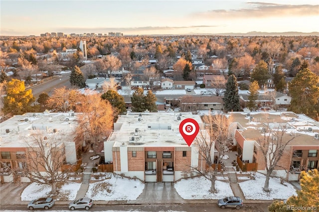 snowy aerial view featuring a residential view