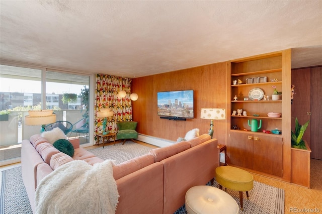 living room featuring a baseboard radiator and wood walls