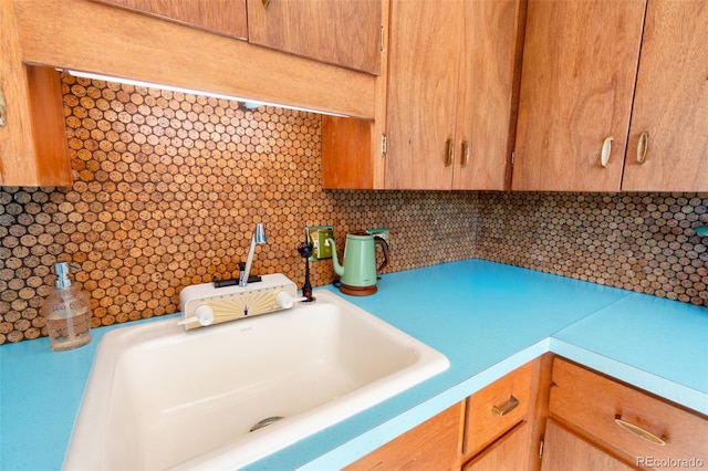 kitchen with light countertops and a sink