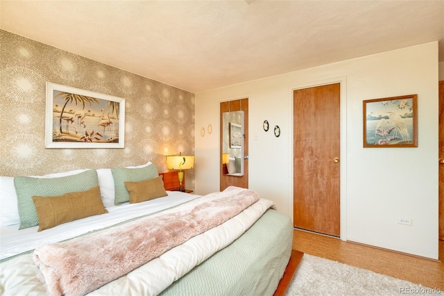 bedroom featuring wallpapered walls