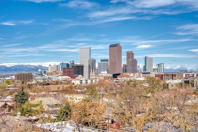 property's view of city with a mountain view