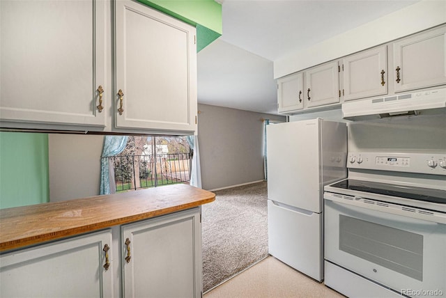 kitchen featuring under cabinet range hood, white appliances, and light countertops