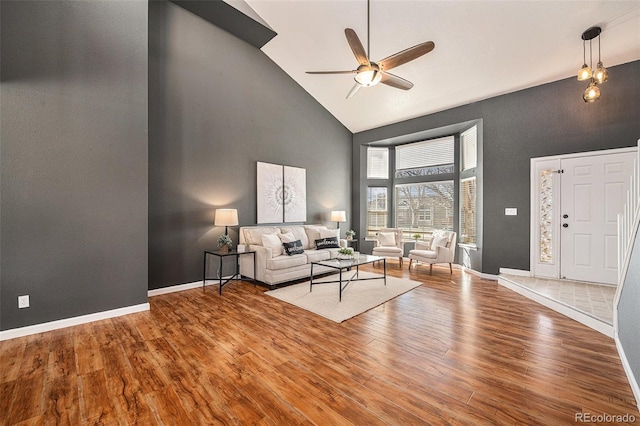 living room featuring high vaulted ceiling, ceiling fan, and hardwood / wood-style floors