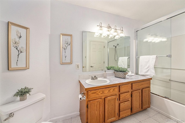 full bathroom with toilet, tile patterned floors, vanity, and shower / bath combination with glass door