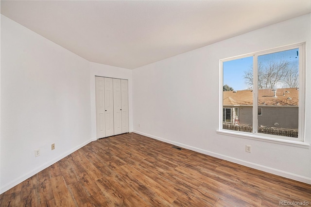 unfurnished room featuring hardwood / wood-style floors