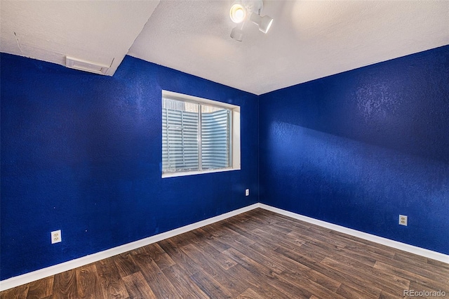 empty room featuring wood-type flooring