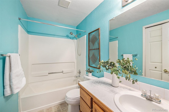 full bathroom featuring washtub / shower combination, toilet, a textured ceiling, and vanity