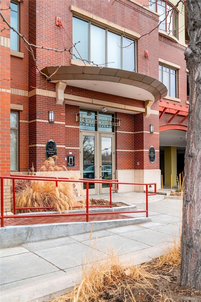 entrance to property with brick siding