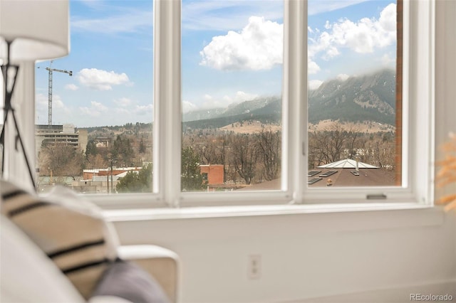 interior space featuring a healthy amount of sunlight and a mountain view