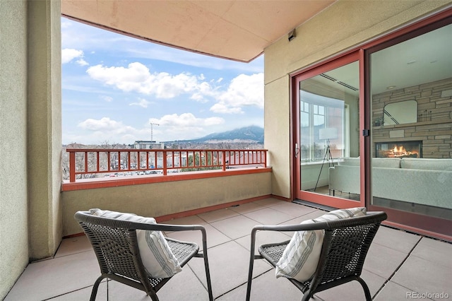 balcony featuring a mountain view