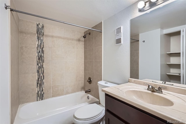 bathroom with shower / bathtub combination, visible vents, a textured wall, toilet, and vanity