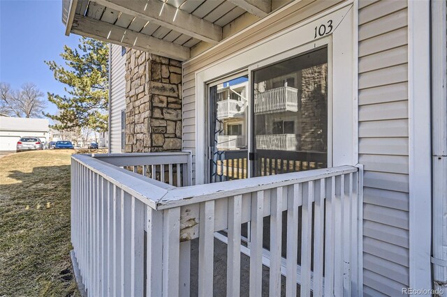 property entrance featuring stone siding