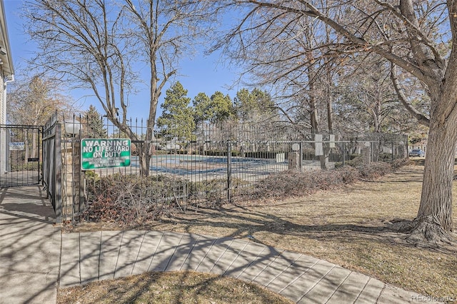 view of yard with fence and a gate