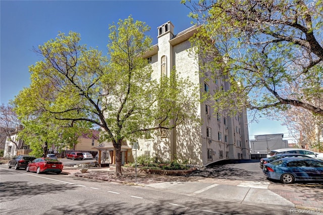 view of side of property featuring stucco siding