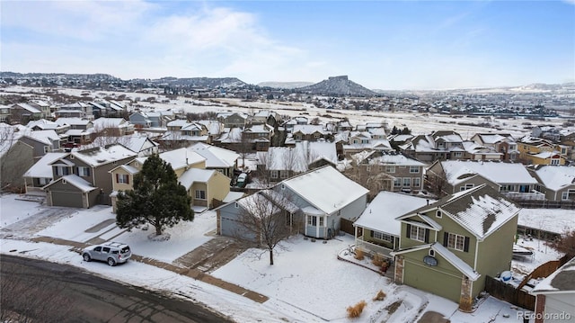 snowy aerial view with a residential view