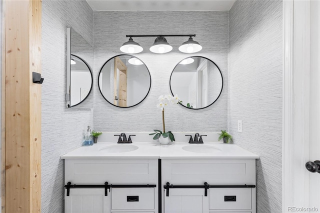 bathroom with double vanity and a sink