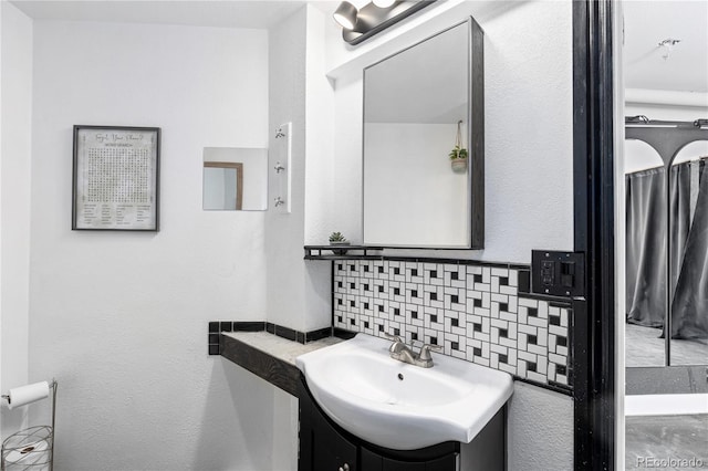 bathroom with backsplash and vanity