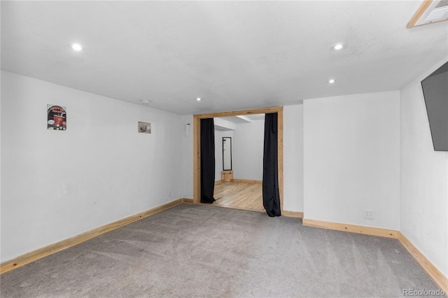 spare room featuring baseboards, carpet, visible vents, and recessed lighting