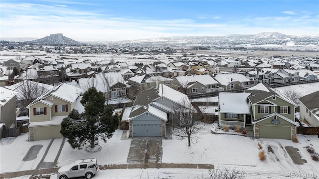 snowy aerial view featuring a residential view