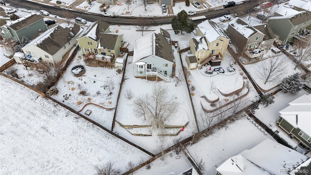 snowy aerial view with a residential view