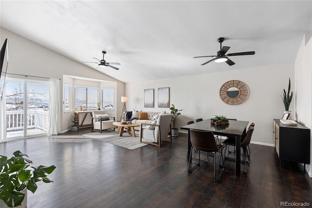 dining room featuring vaulted ceiling, dark wood finished floors, a ceiling fan, and baseboards