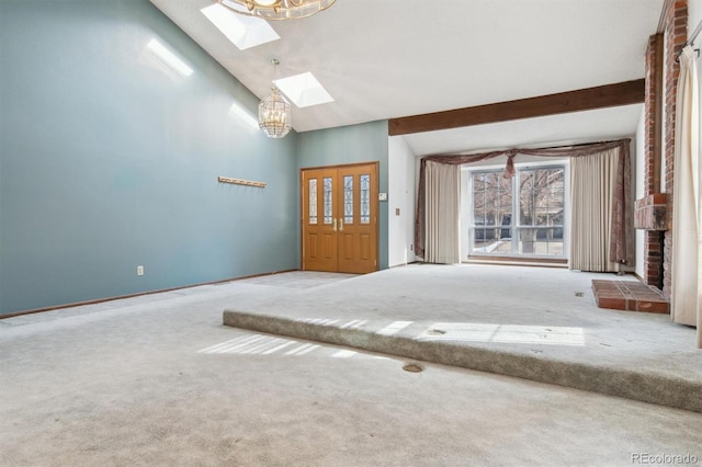 carpeted spare room featuring high vaulted ceiling, beam ceiling, a skylight, and an inviting chandelier