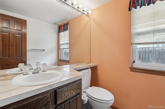 bathroom with vanity and toilet