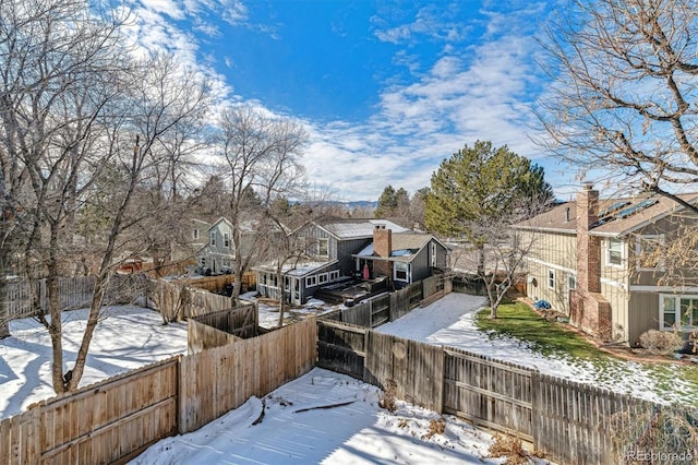 view of yard layered in snow