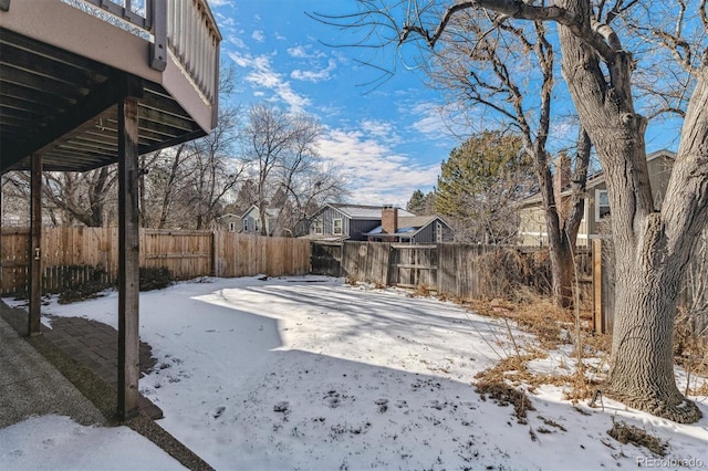 view of yard layered in snow