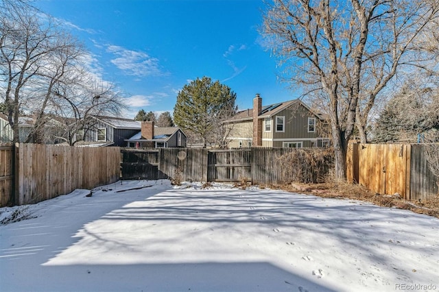 view of yard layered in snow