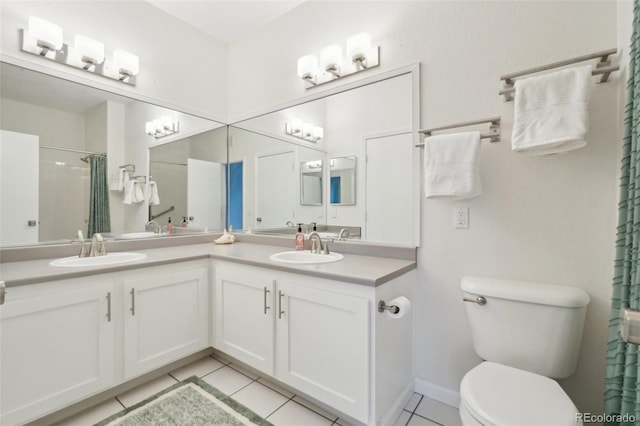 full bathroom featuring double vanity, toilet, a sink, and tile patterned flooring
