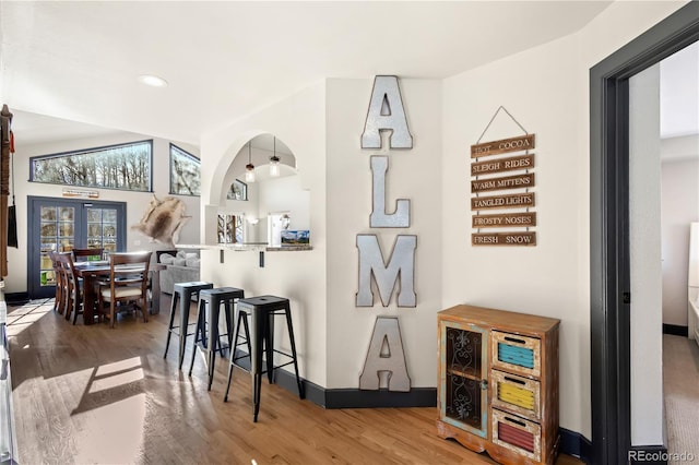 interior space with hardwood / wood-style flooring and french doors