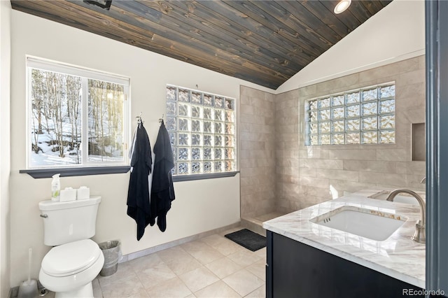 bathroom with vanity, lofted ceiling, a wealth of natural light, and wooden ceiling