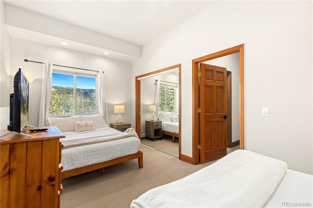 carpeted bedroom with a closet