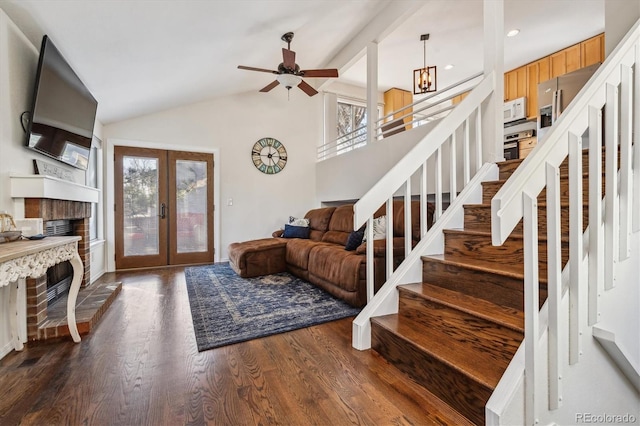 entrance foyer with french doors, plenty of natural light, dark wood-style floors, and stairway