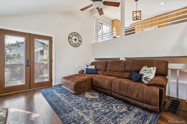 living room with visible vents, ceiling fan, vaulted ceiling, hardwood / wood-style flooring, and french doors