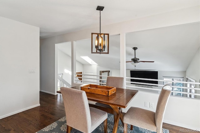 dining area with vaulted ceiling, a ceiling fan, baseboards, and wood finished floors