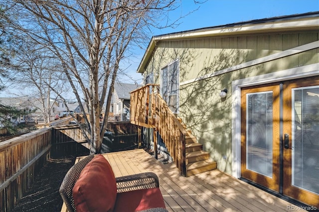 wooden deck featuring a residential view and fence