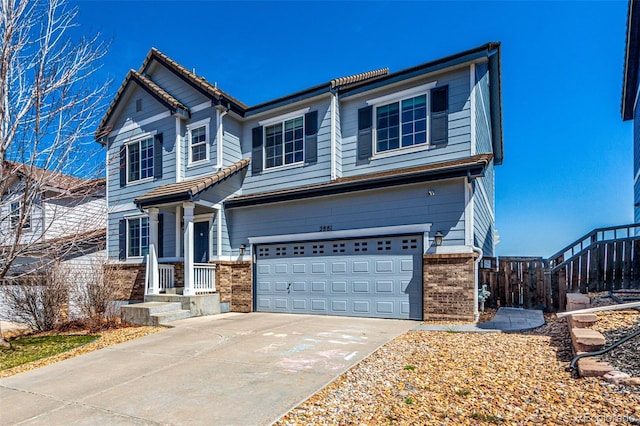2881 Black Canyon Way, Castle Rock, CO 80109 - view of front of home with brick siding, an attached garage, concrete driveway, and fence