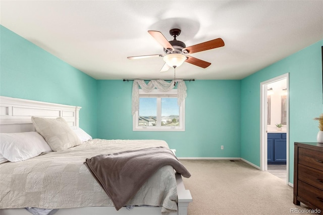 2881 Black Canyon Way, Castle Rock, CO 80109 - bedroom featuring light carpet, ensuite bathroom, baseboards, and a ceiling fan