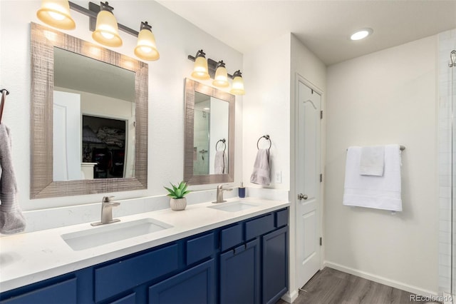 2881 Black Canyon Way, Castle Rock, CO 80109 - full bath with baseboards, wood finished floors, a sink, and double vanity