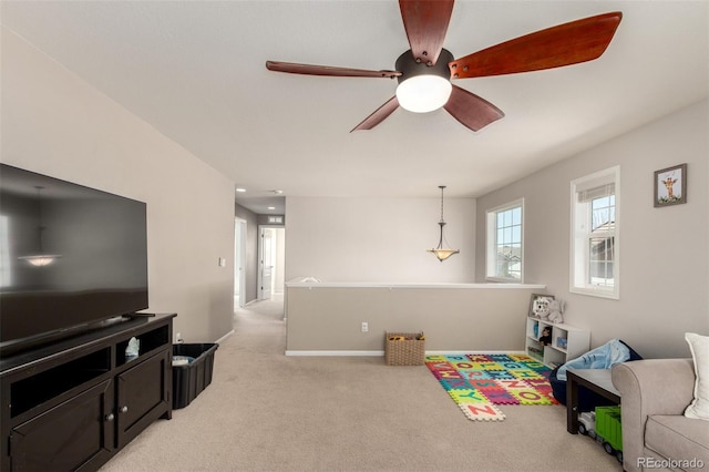 2881 Black Canyon Way, Castle Rock, CO 80109 - rec room with light carpet, a ceiling fan, and baseboards